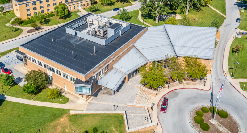 Erma Ora Byrd Hall - aerial view of a brick building by a road