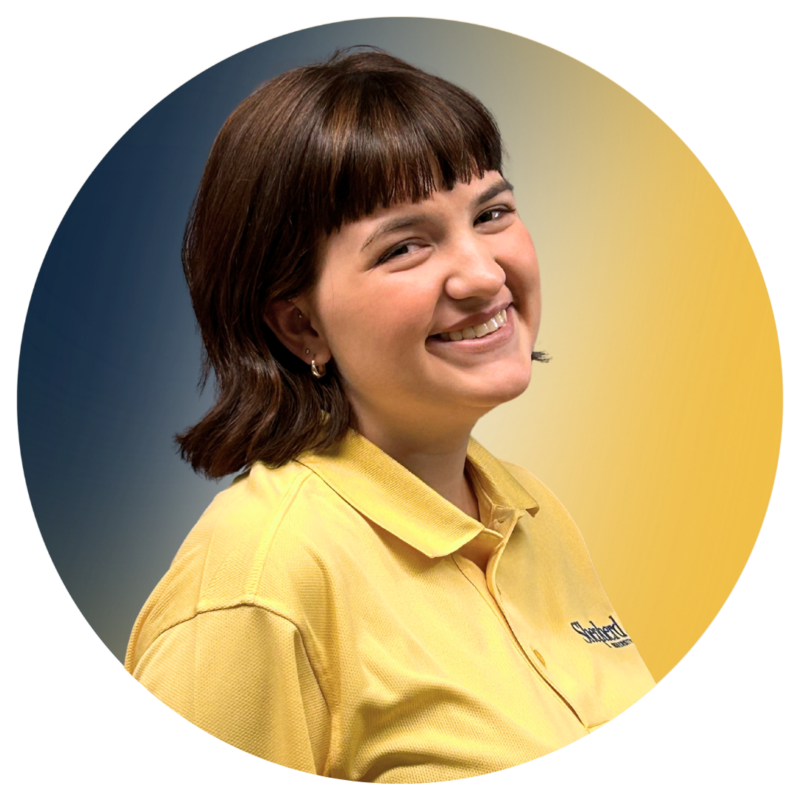 A-Team member Brooke wearing her A-Team yellow polo.