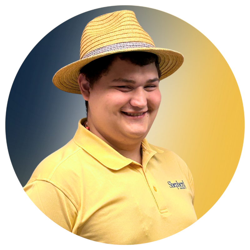 A-Team member Daniel wearing his A-Team yellow polo.