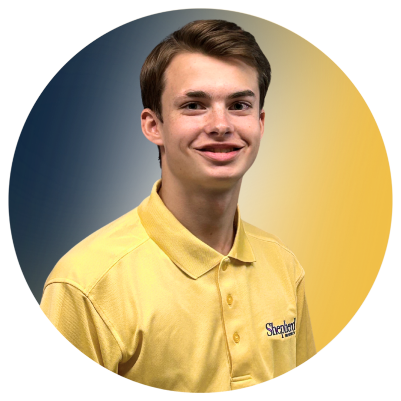 A-Team member Ethan wearing his A-Team yellow polo.